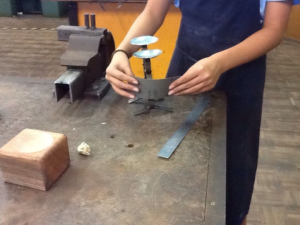 Then use sandpaper and sand your candleholder until it's smooth