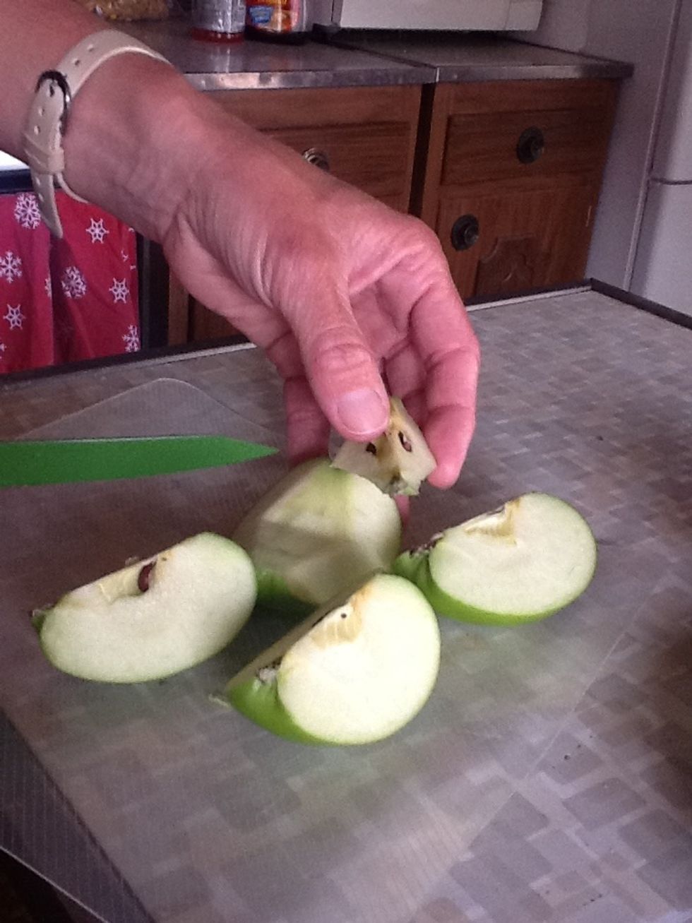 Then use triangle cuts to cut the core out of each quarter.