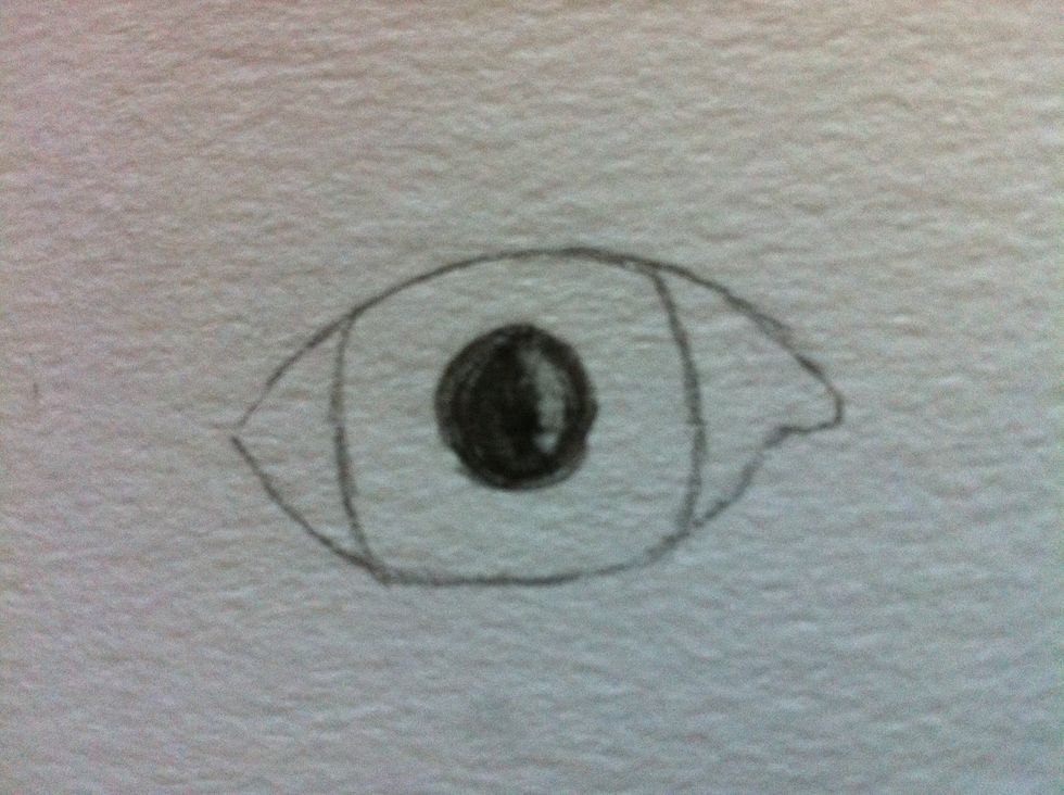 Then, use your eraser to create a shine in the pupil. It will give it definition and make it look more lifelike.