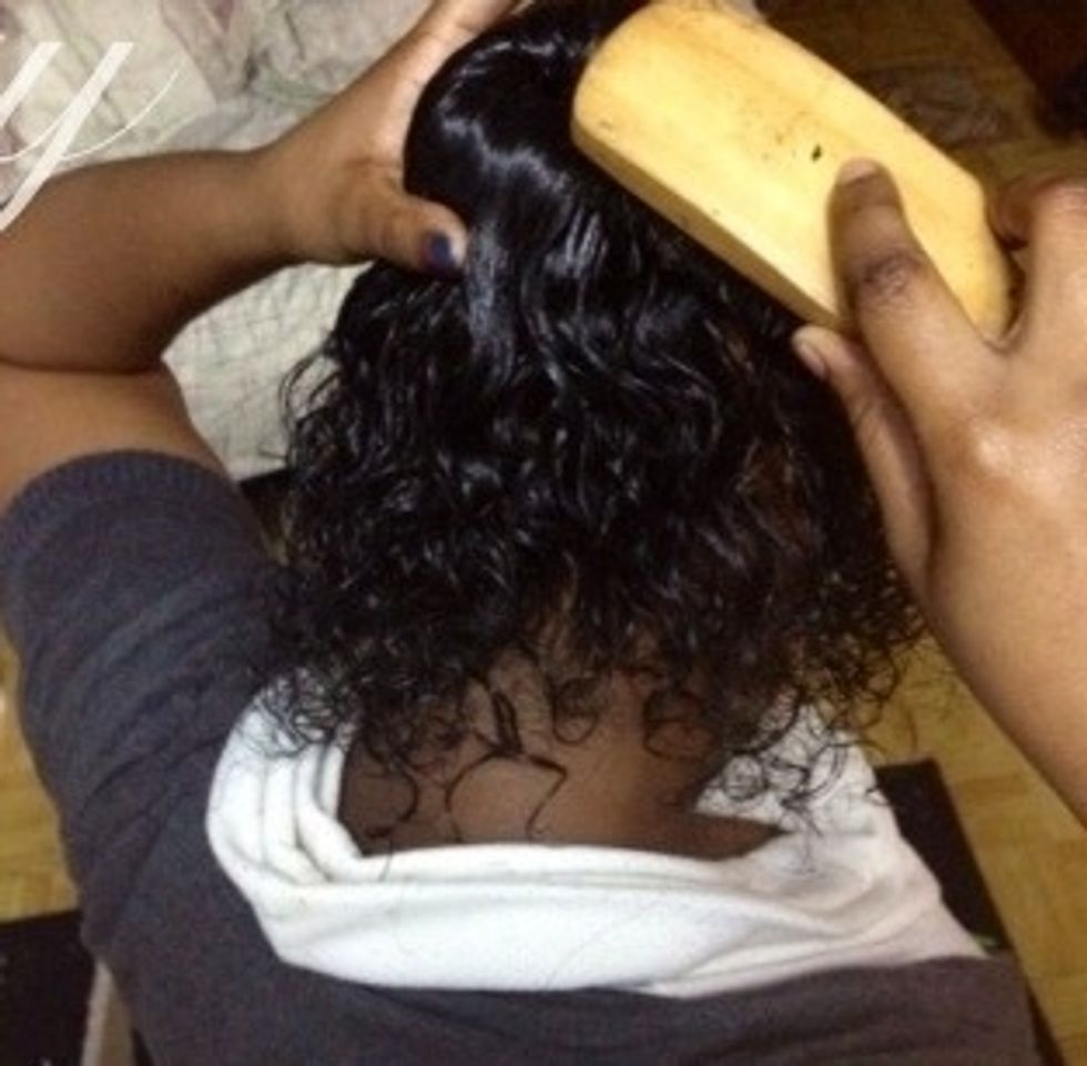 Then using a brush spread hair to cover the sock.