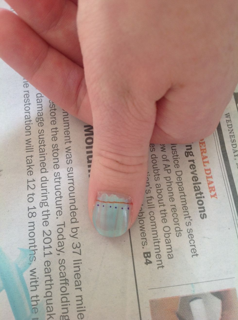 Then using a different color, add dots across the nail