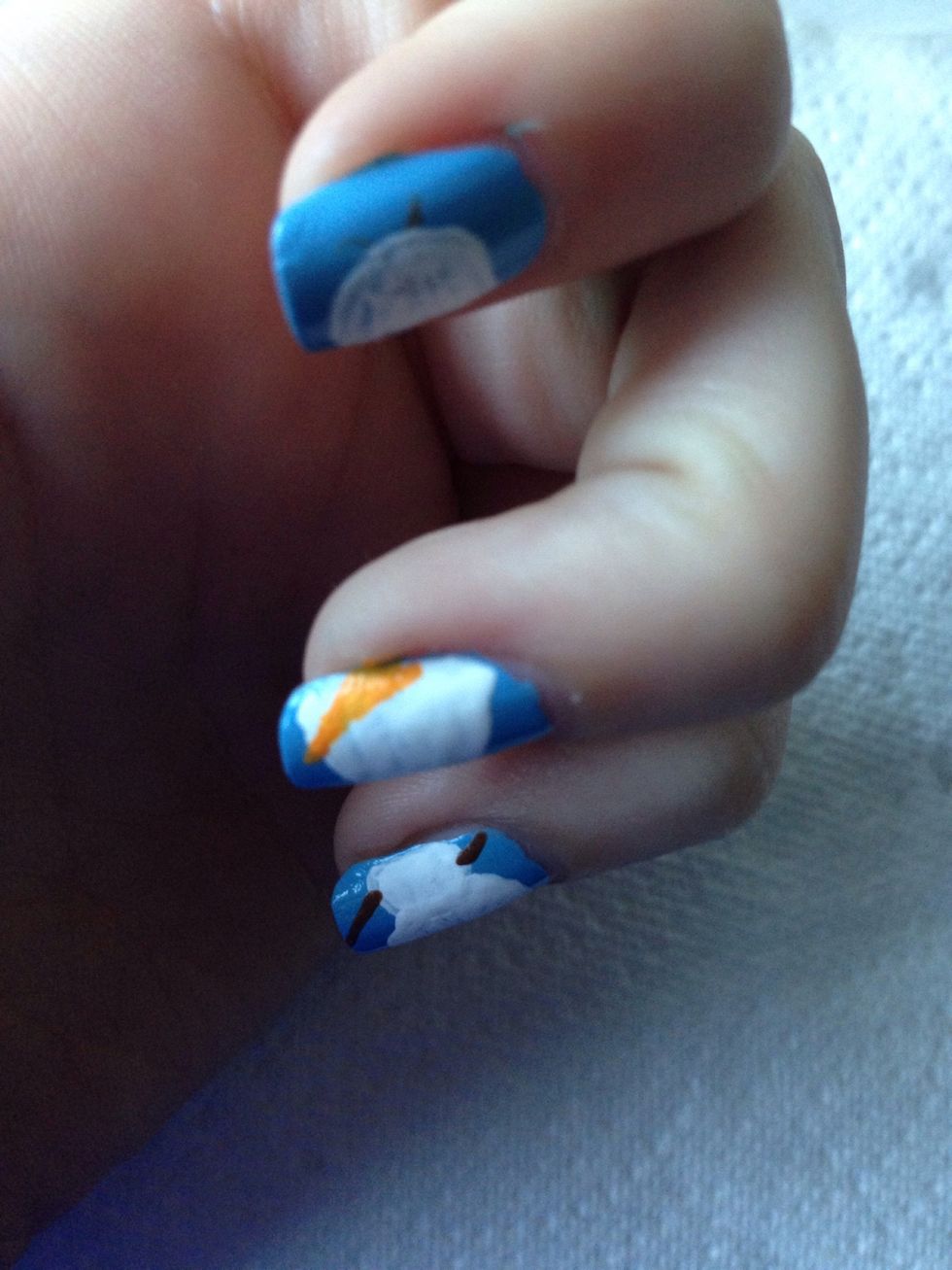 Then using orange add his carrot nose