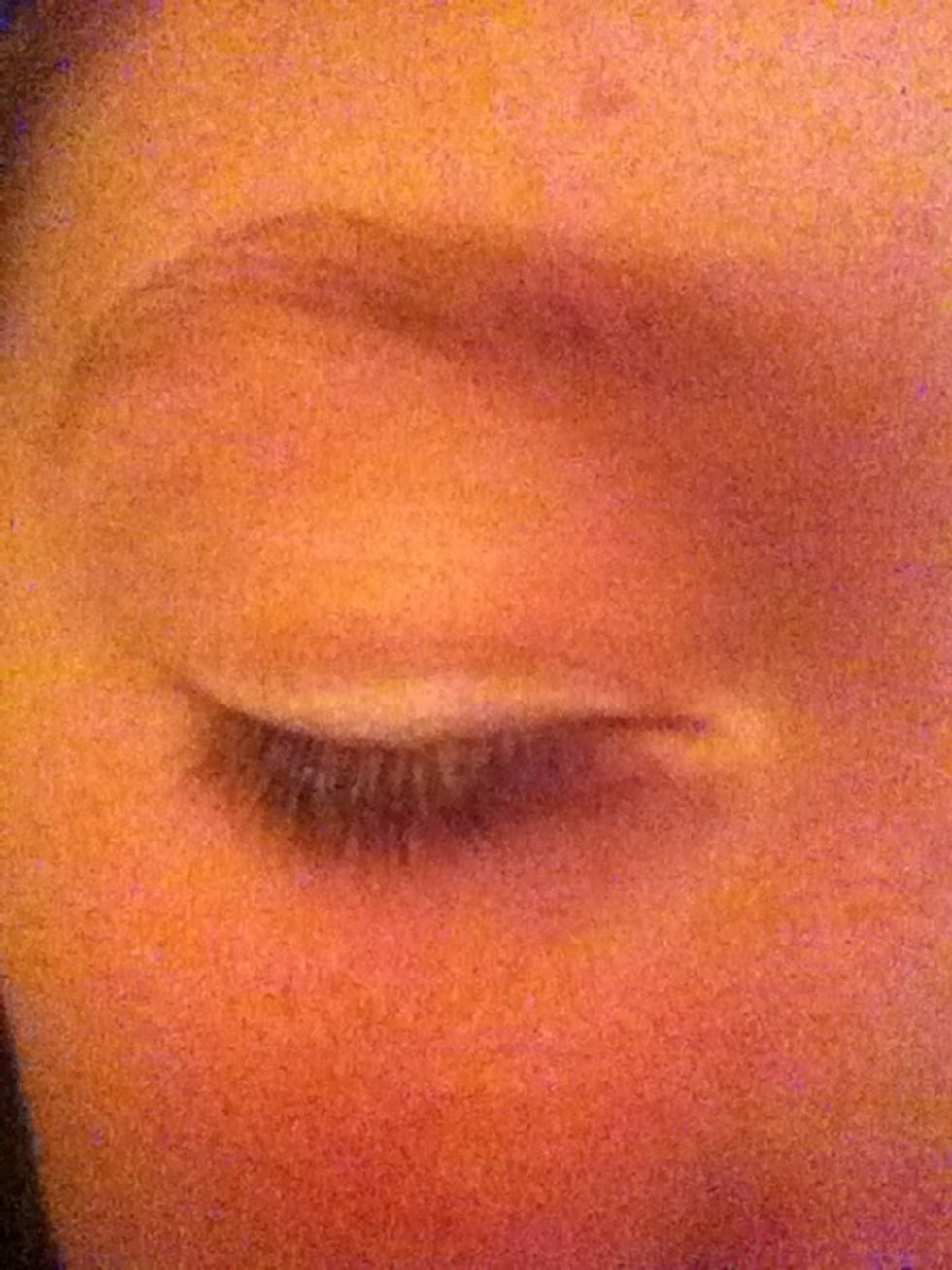 Then using the white eyeshadow and eyeshadow brush, sweep across the lash line.