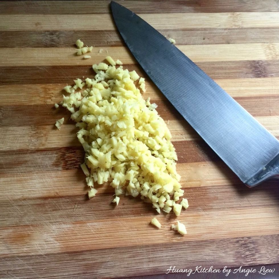 Then, wash and skin a piece of ginger. Mince into small pieces.