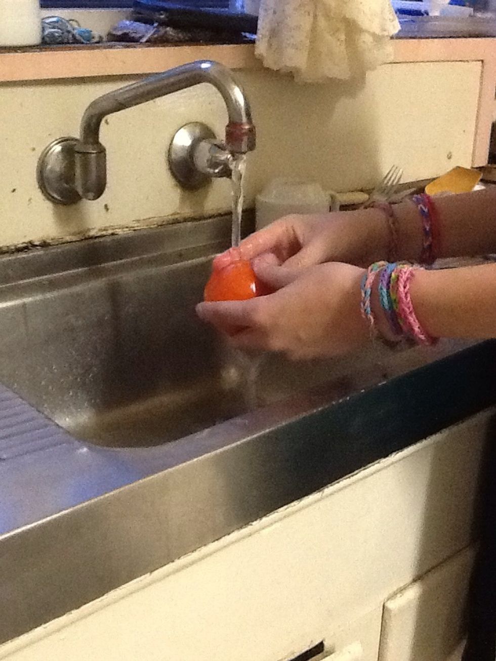 Then wash the tomato under cold water.