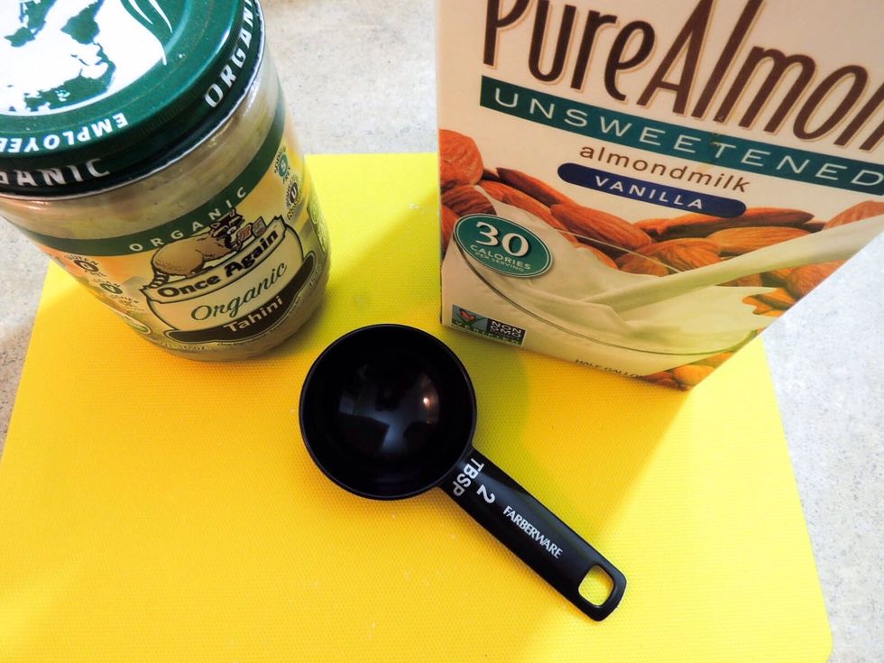 Then we'll add tahini (sesame seed butter) and unsweetened almond milk 2 Tablespoons each