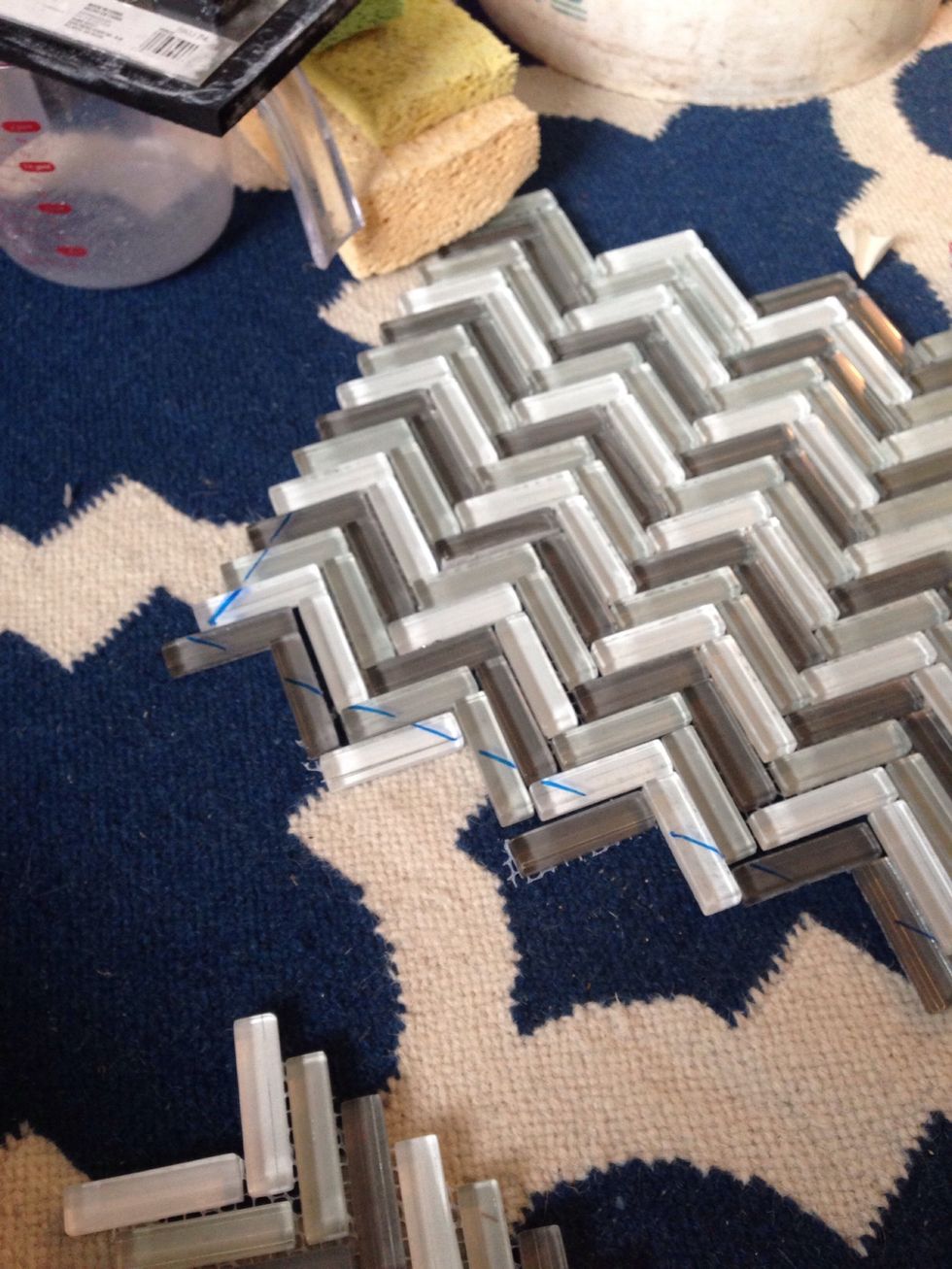 Then we marked off the edges to cut with the saw. Going along the lowest point in the pattern, you'll cut the edges off to leave triangles to complete the pattern.