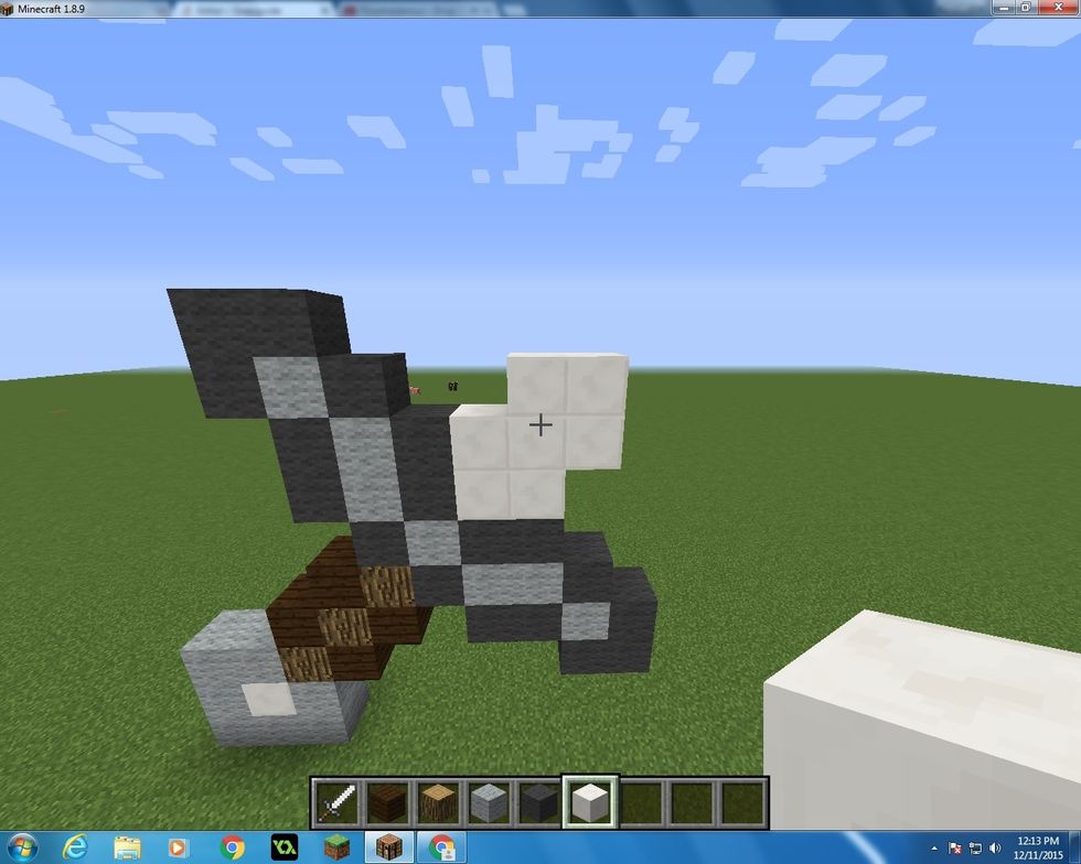 Then we will start adding the Quartz Blocks in this shape. First you want to make a square then continue it with 3 more on top.