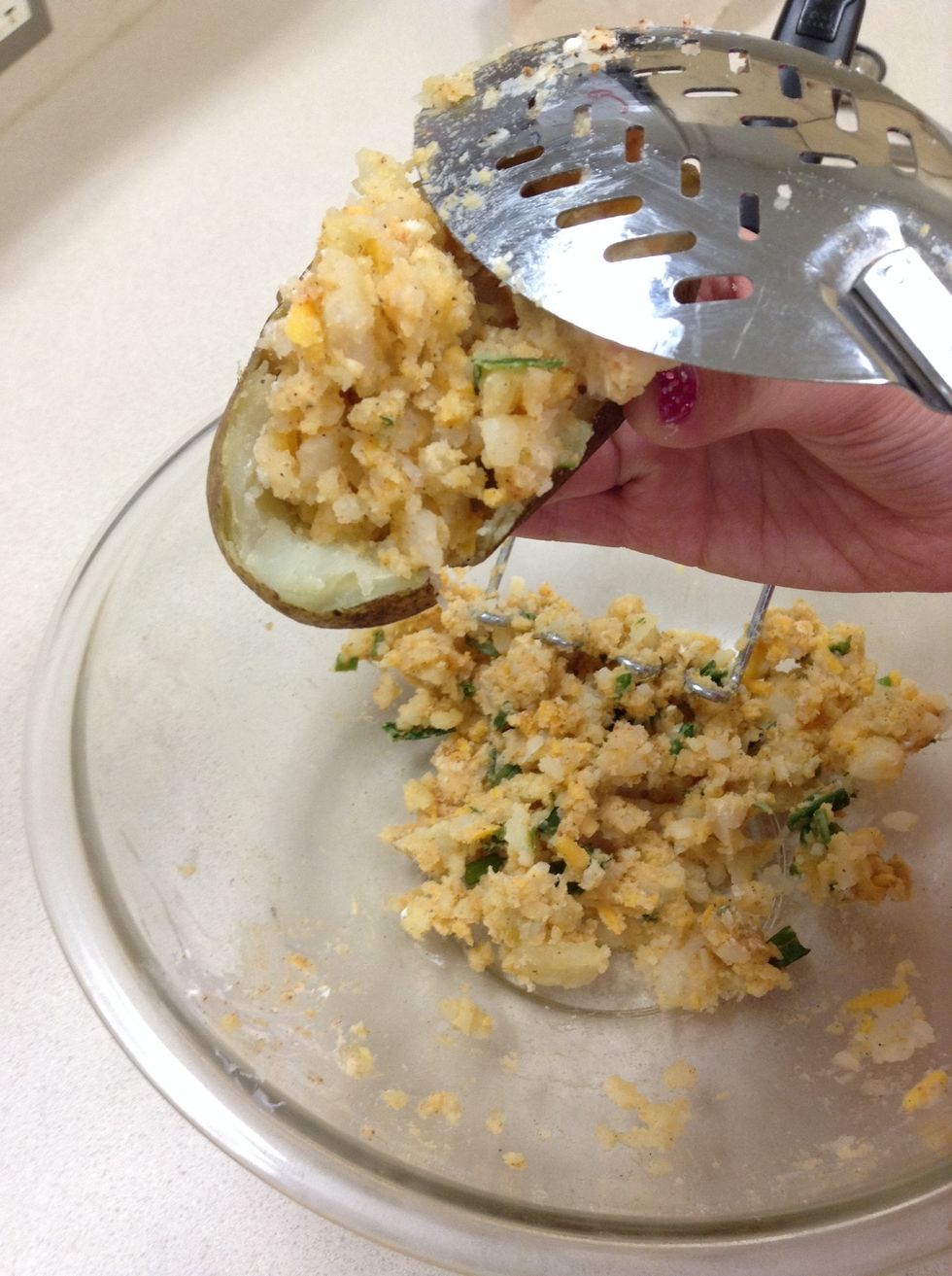 Then when you finish mashing, scoop the potatoes back into the potato