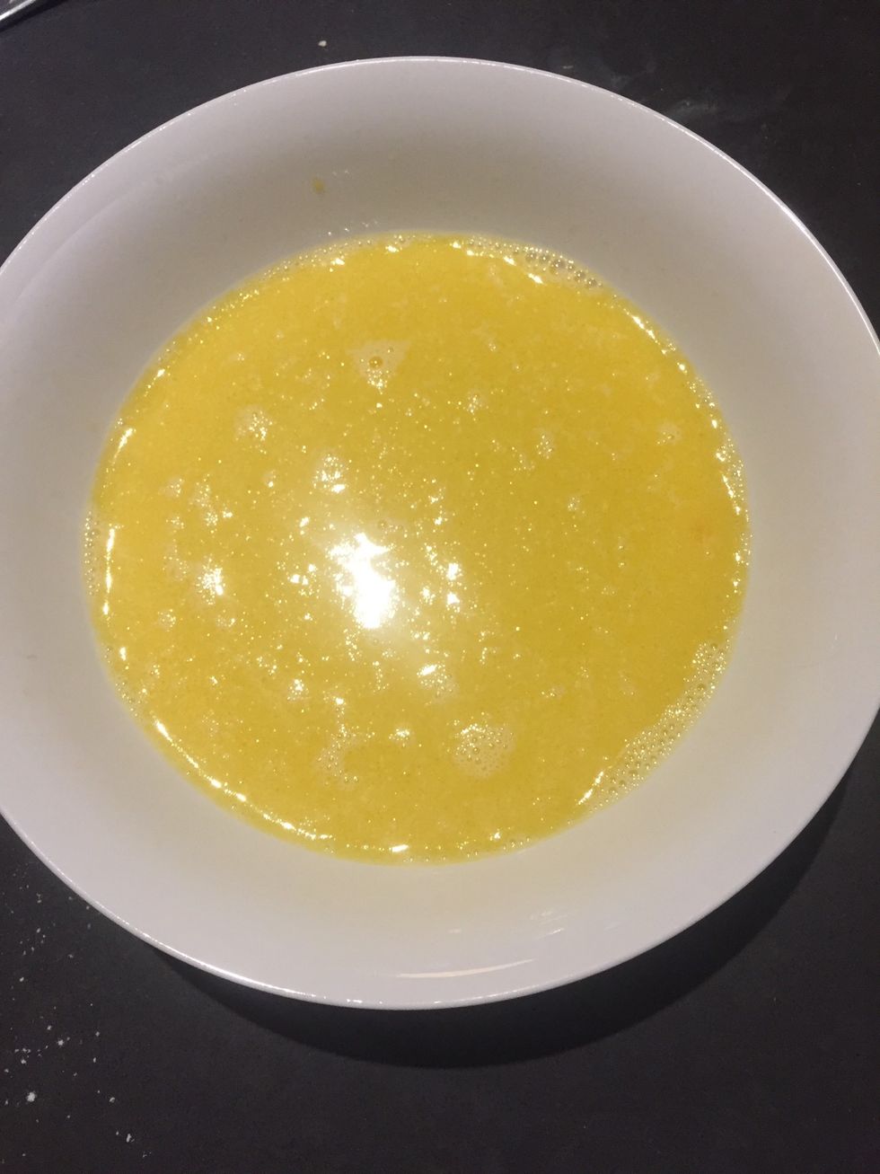 Then Whisk together eggs,milk and oil in a separate bowl