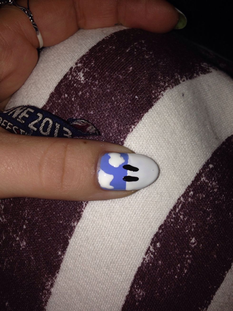 Then with a nail brush make two black lines for eyes