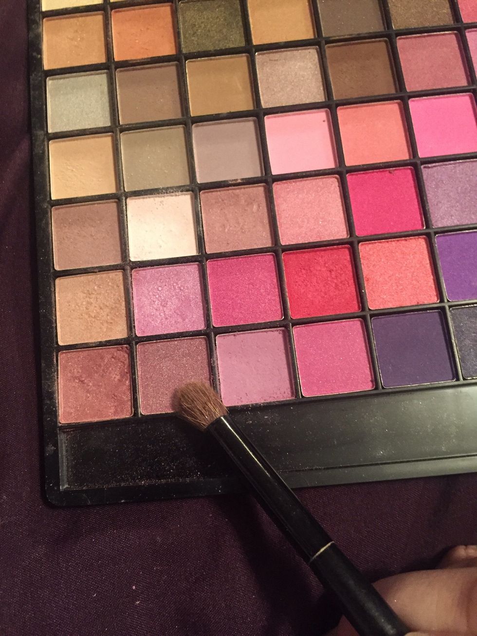 Then with another clean brush apply this eyeshadow on it.