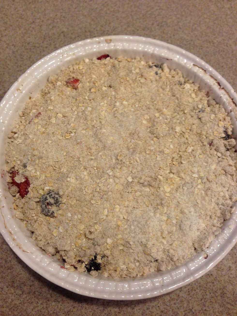 Then with the remainder of the crumble mix, pour the rest on top for a crust. At this point you can go ahead and bake it as is or you can add a few small cubes of butter, so it'll get a nice crisp!