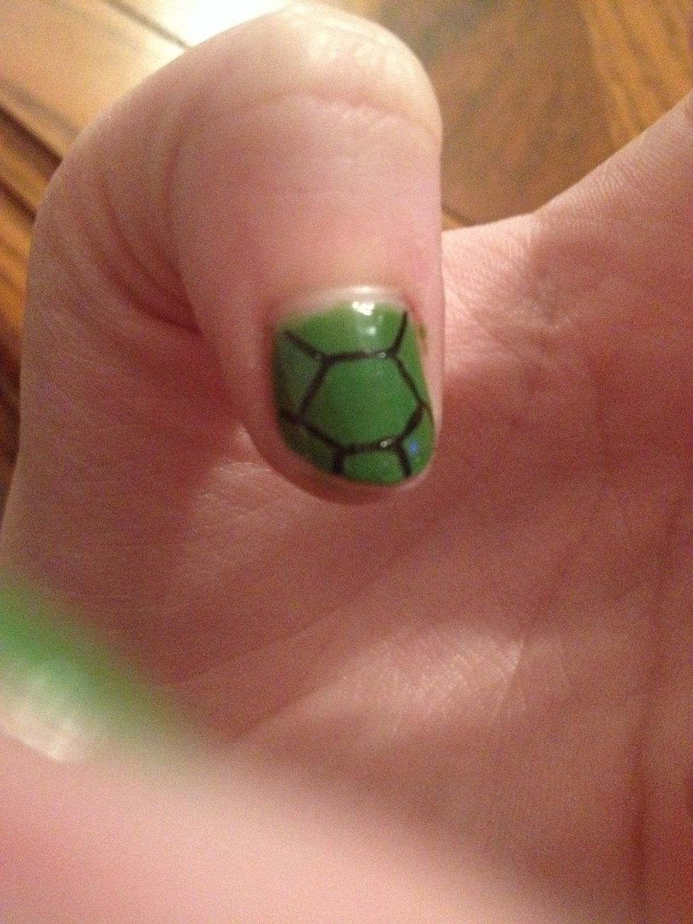 Then with your black nail art pen (or a toothpick or something similar) paint lines in the shape of a turtle shell. Don't know what it looks like? Look it up :)