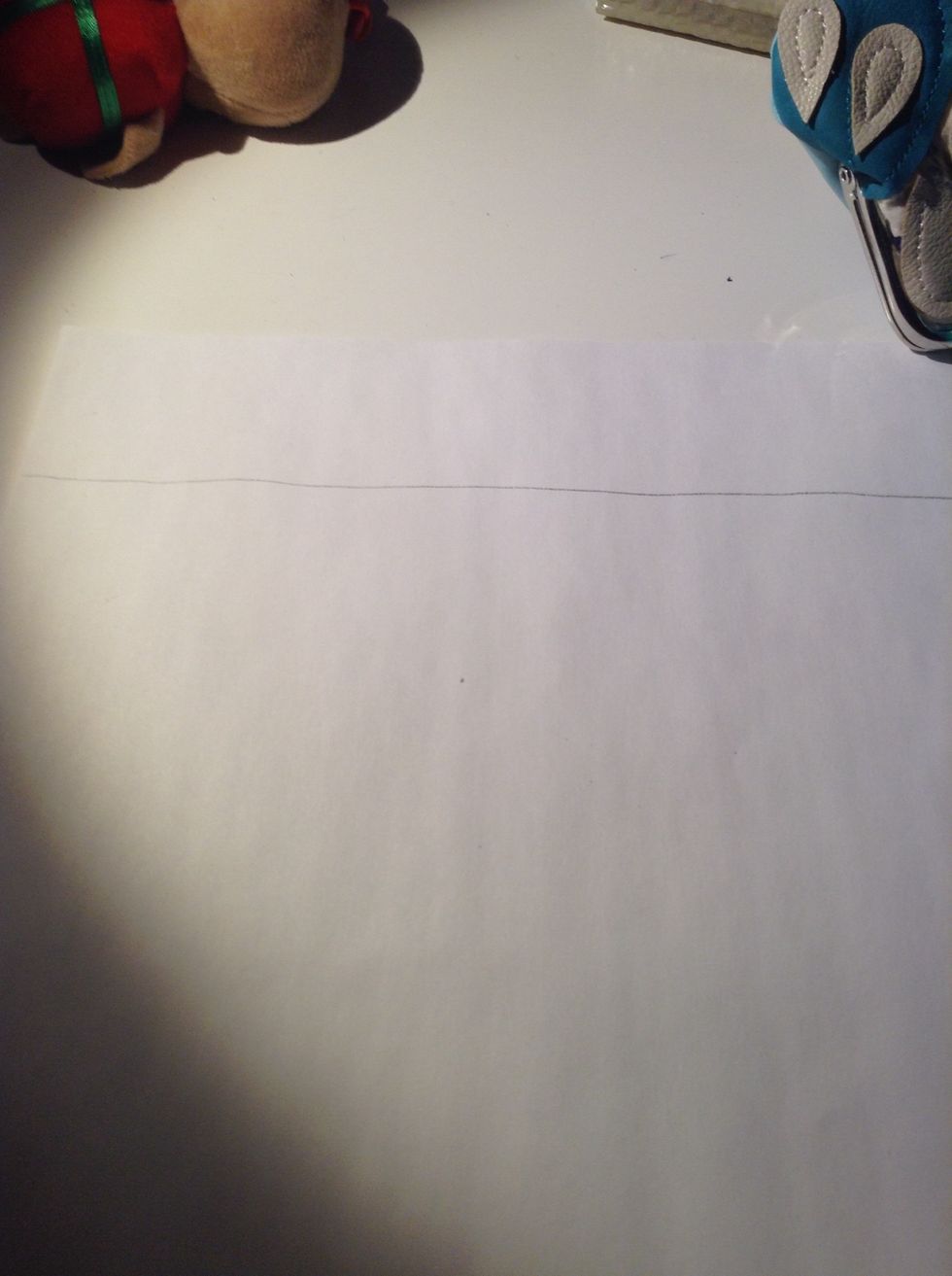 Then with your ruler I don't have one but use your ruler to draw a straight line around the top of the page ( you can put your page the long way or the wide way I did my the long way)