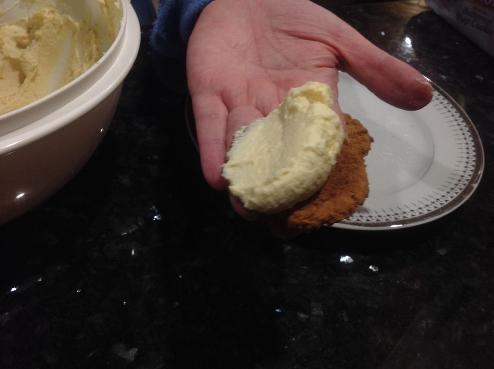 Then with your spoon. Scoop some of the Philadelphia and place it on the cookie.