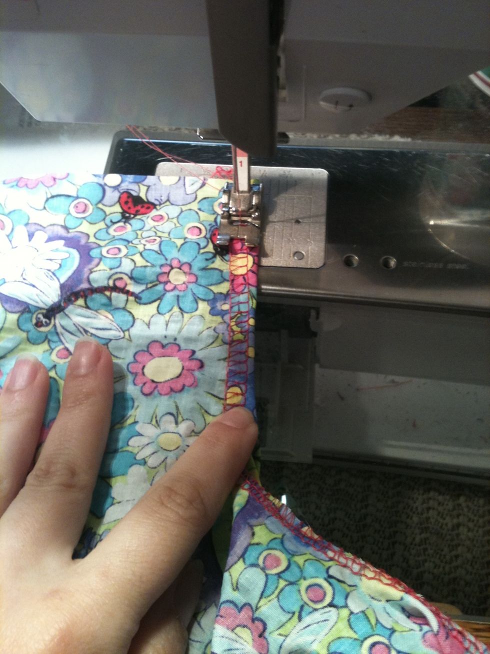 Then, working from the wrong side, fold in 1/4- 3/8 inch of fabric and stitch down....