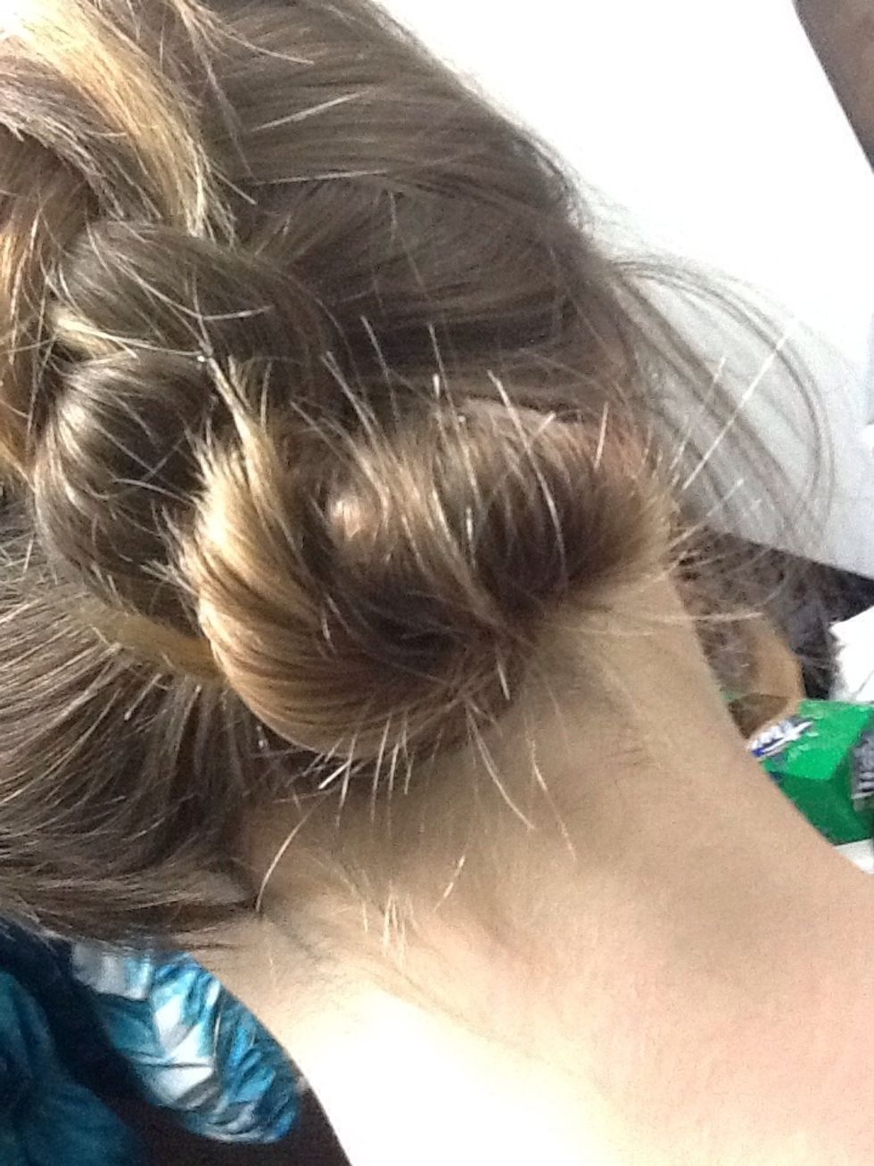 Then wrap pony tail around the hair tie and fasten with bobby pins to create a bun