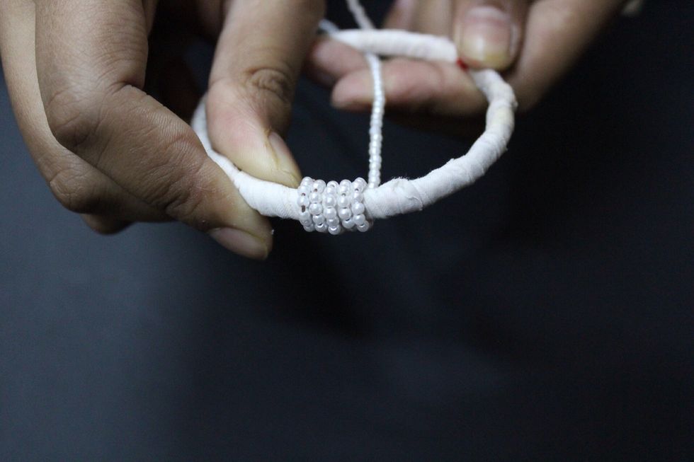 Then,wrap the beaded wire around the bangle.