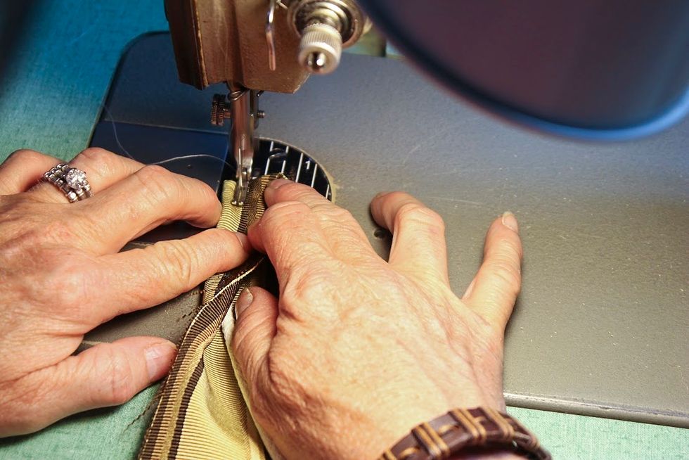 Then wrap the fabric around the piping/cord and stitch all the way down using a velvet foot.  This foot keeps the stitching away from the piping ........