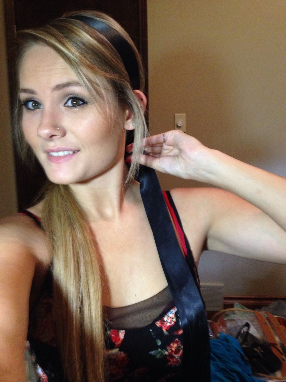 Then wrap the ribbon around your head comfortable tight. Tie a knot. Leaving both sides of the ribbon even and falling loosely.