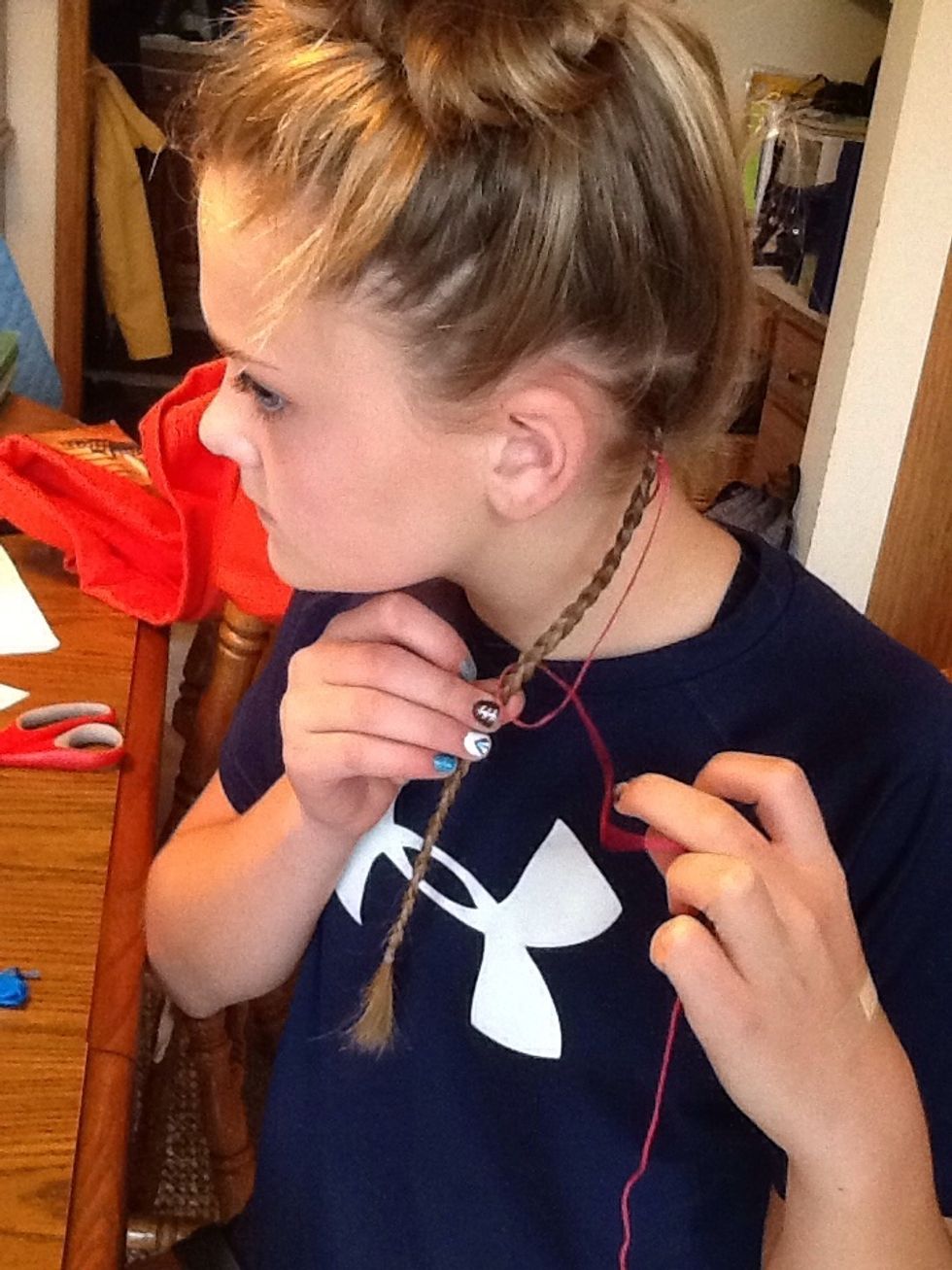 Then wrap the tail of the four around the braid and through the triangle of the four