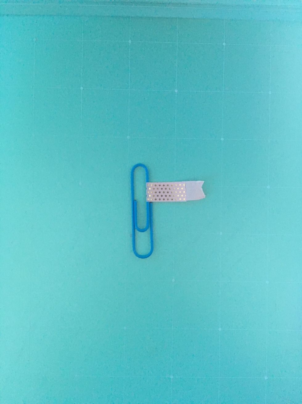 Then wrap the tape around to make the sticky sides meet.