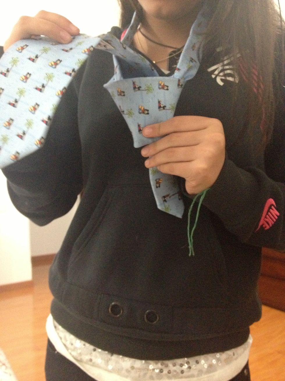 Then you are going to pass it again through the Middle and in between the piece you just passed