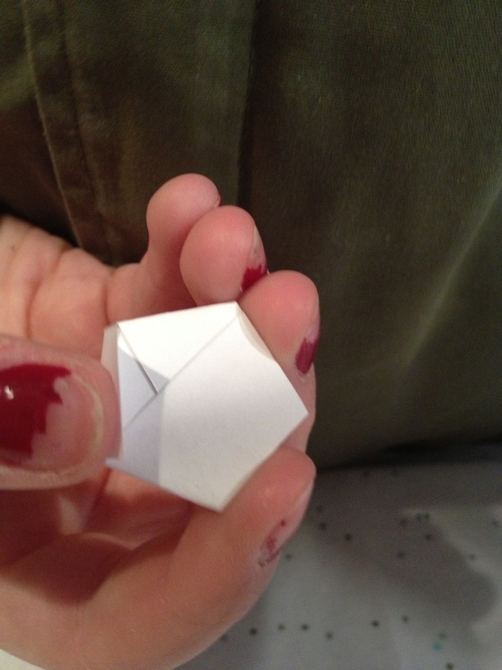 Then you Bend the last of the flaps in like in the start