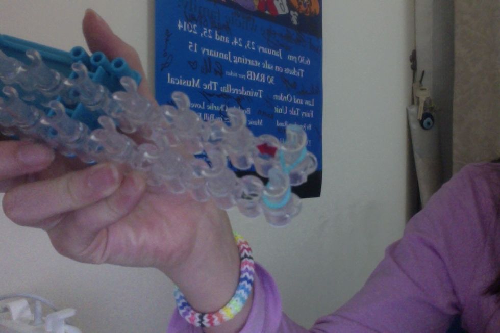 Then you can take that band and place it on your first 2 pegs.