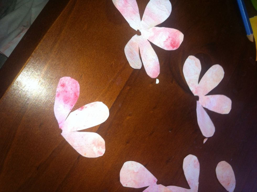 Then you cut one petal from one flower, two petals from the next then three petals on the last flower and keep the extra petals