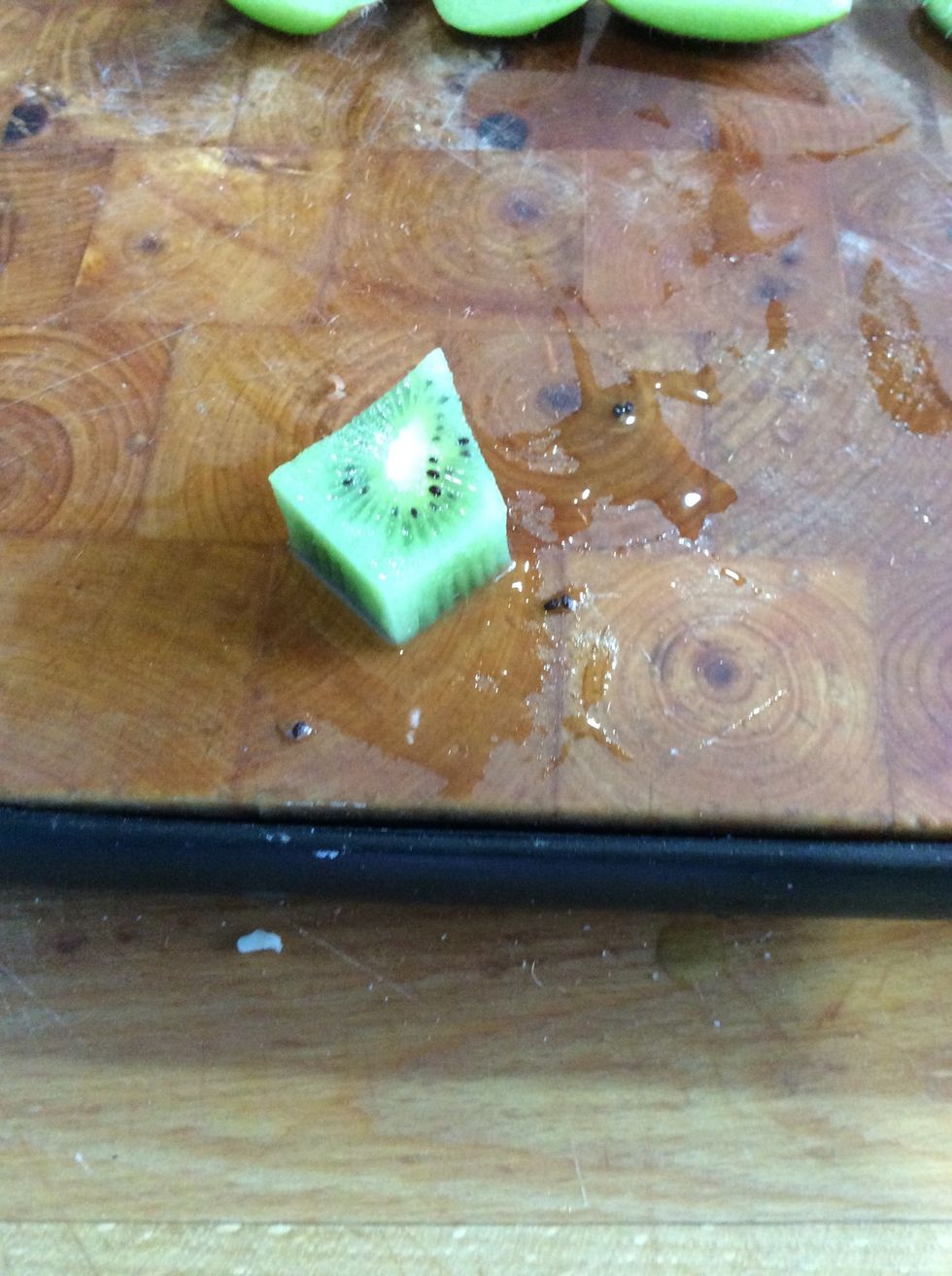 Then, you cut your kiwi into a diamond but cut half of the bottom off.