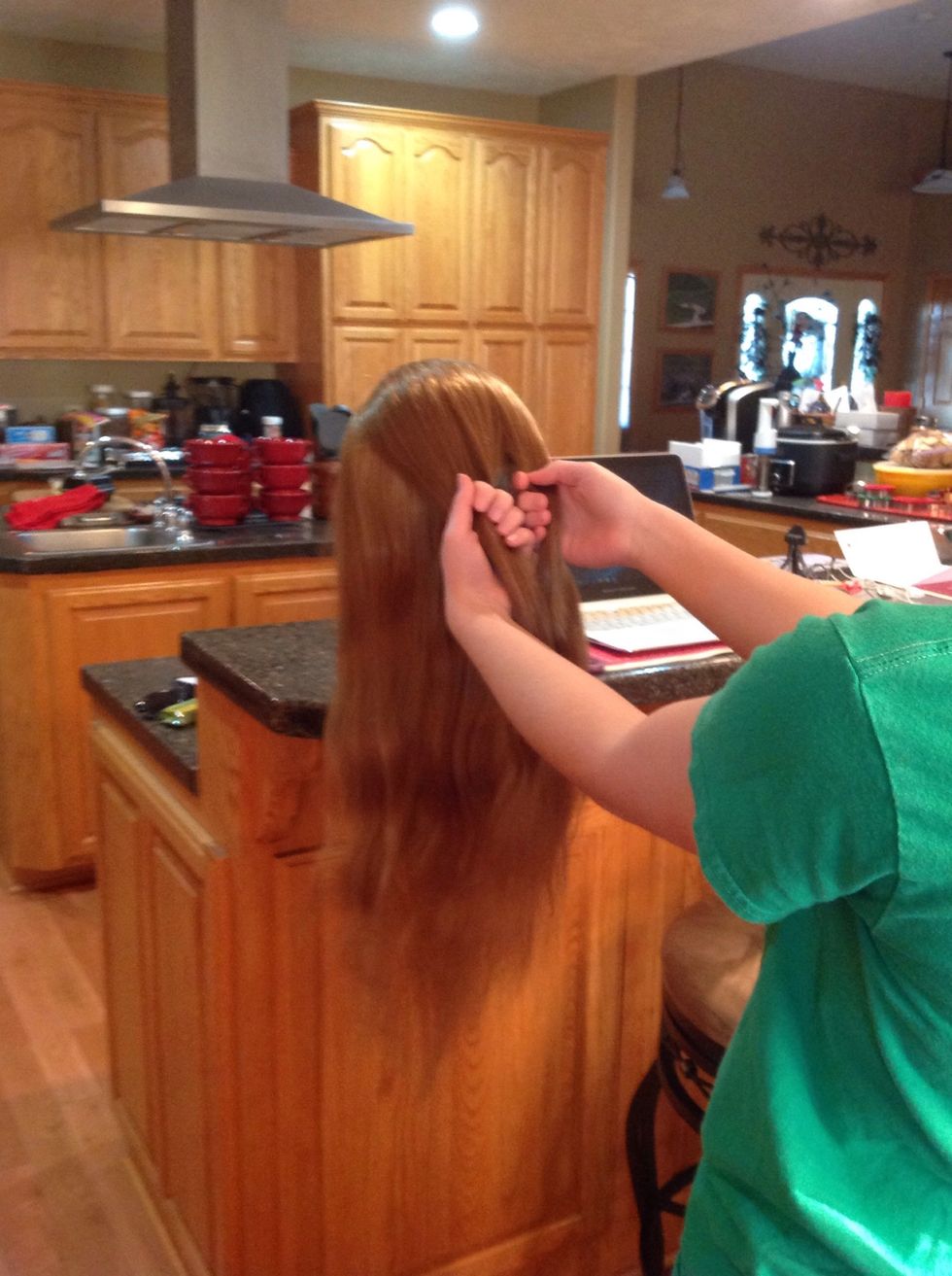 Then you divide the hair into three even sections.