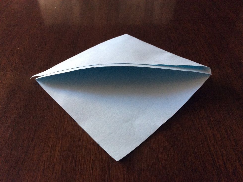Then you fold the two triangles one on top of the other and glue the top one to the bottom one to look like this