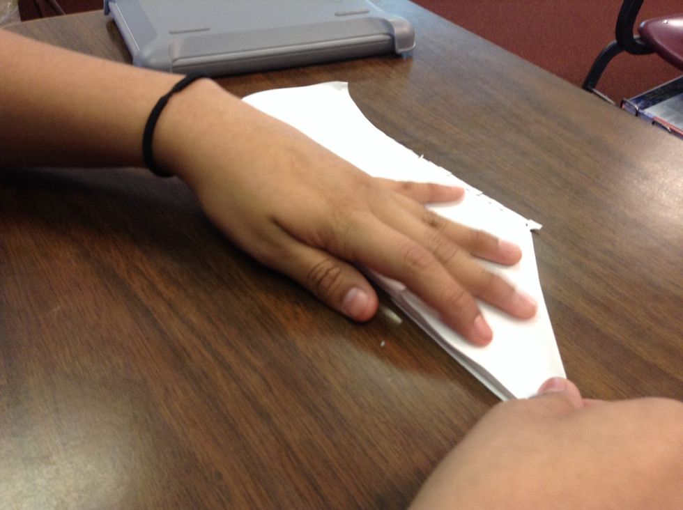 Then you fold the whole paper , down all the way