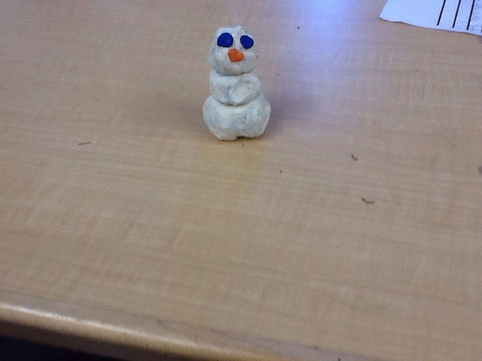 Then you get 2 little pieces of blue clay and make eyes.