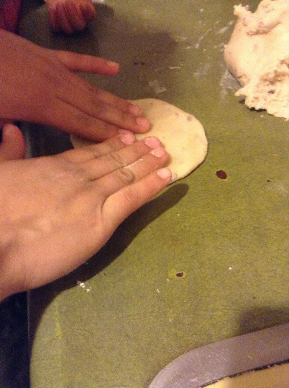 Then you get a little bit of the dough and shape it.