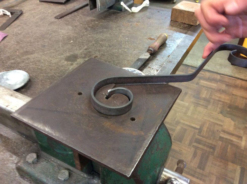 Then you get the scroll maker and scroll each ends of the metal.