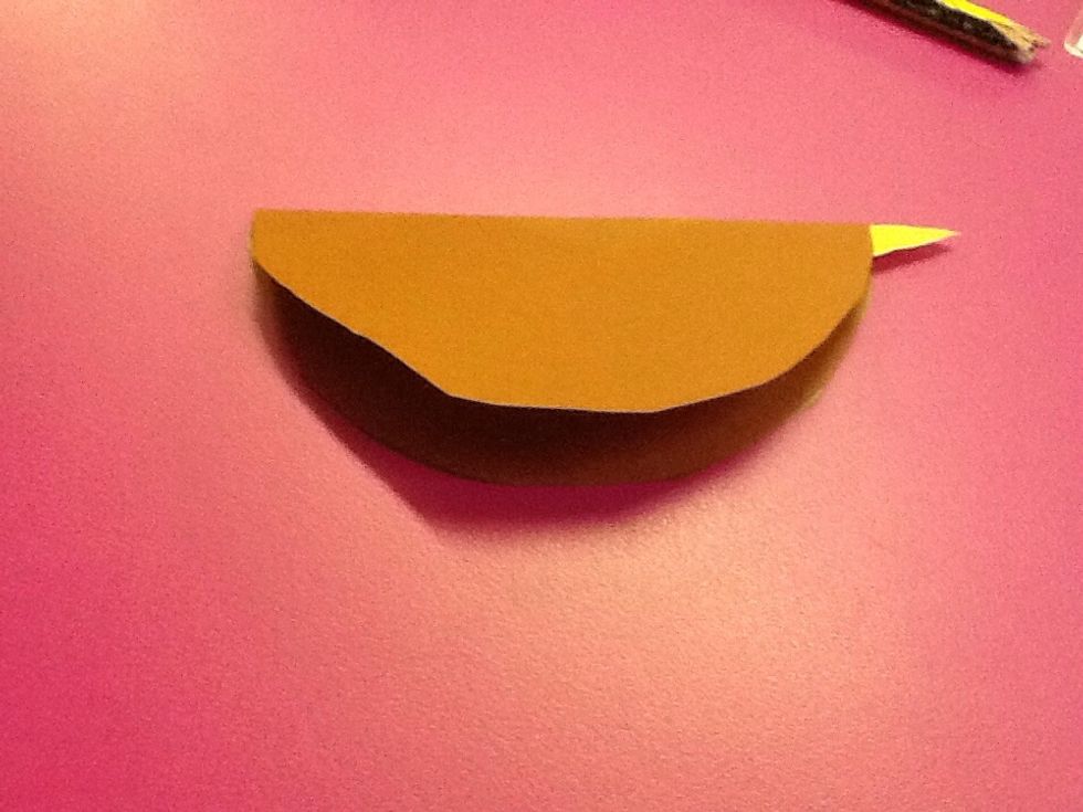 Then,you glue the beak into the folded circle.