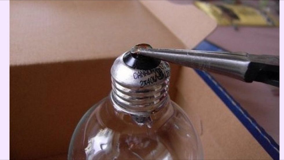 Then you have to take this part out of the lamp using Pliers and be carfull .