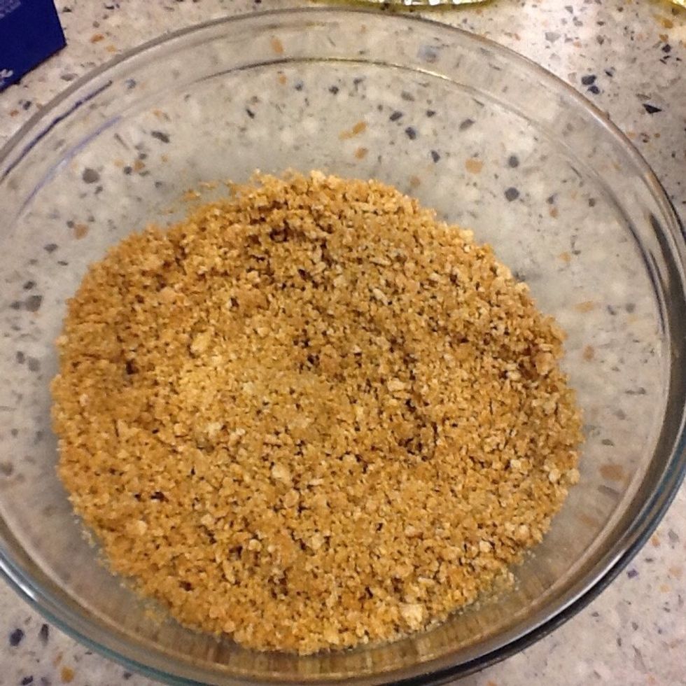 Then you'll crush up some gram crackers, add sugar and butter