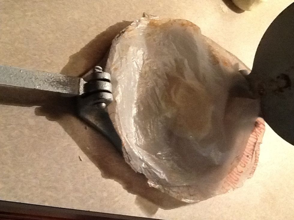Then you'll place the other plastic on top of the masa dough like this