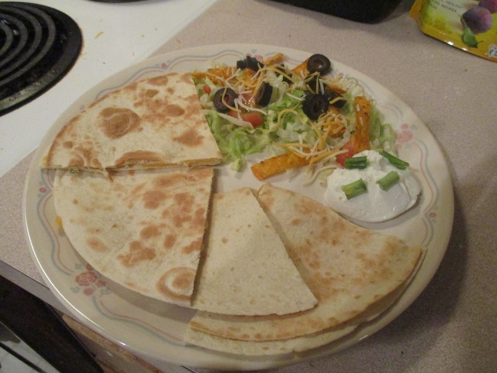 Then you make a little salad (add lettuce, diced tomato, and Tortilla Stripes) put the tortilla and add a scoop of sour cream and Scallions. Enjoy!