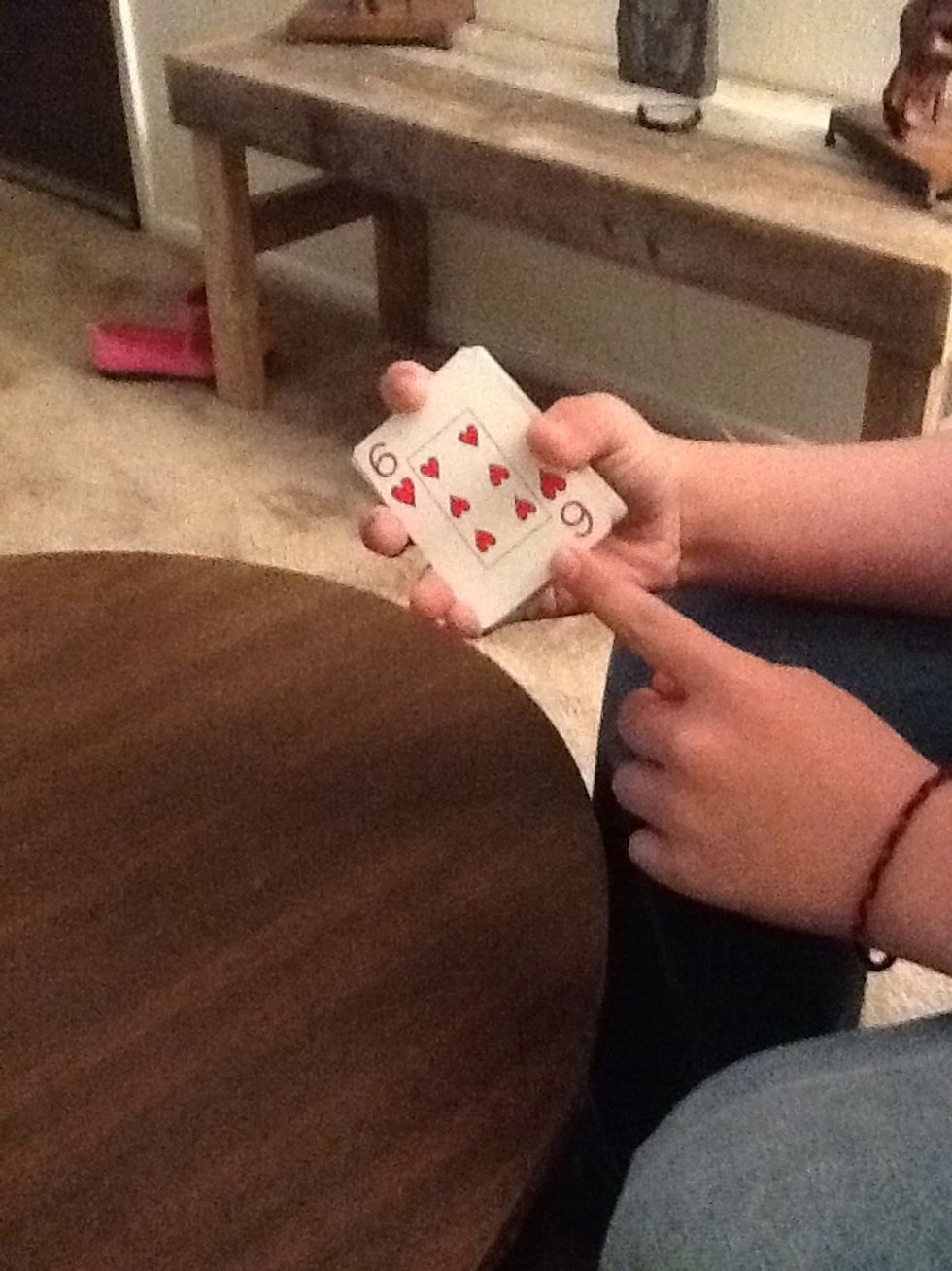 Then you must show the bottom card and ask "is this your card" (obviously not)