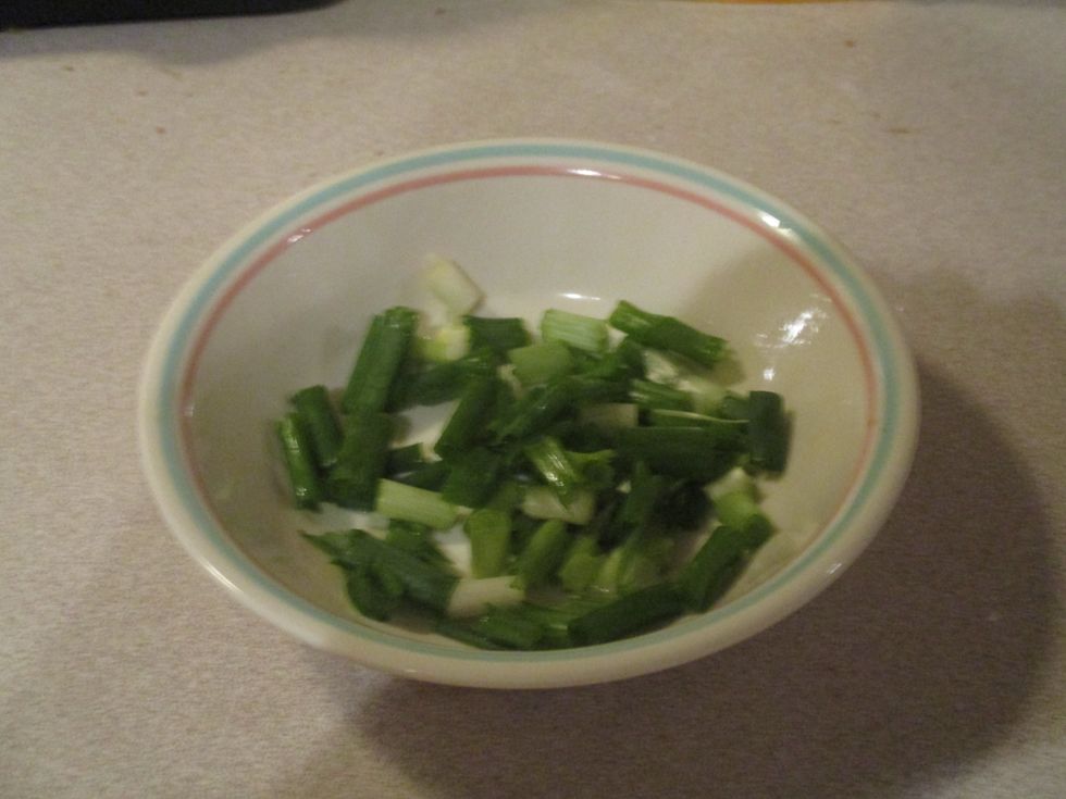Then you put the chopped pieces of Scallions into a small bowl.