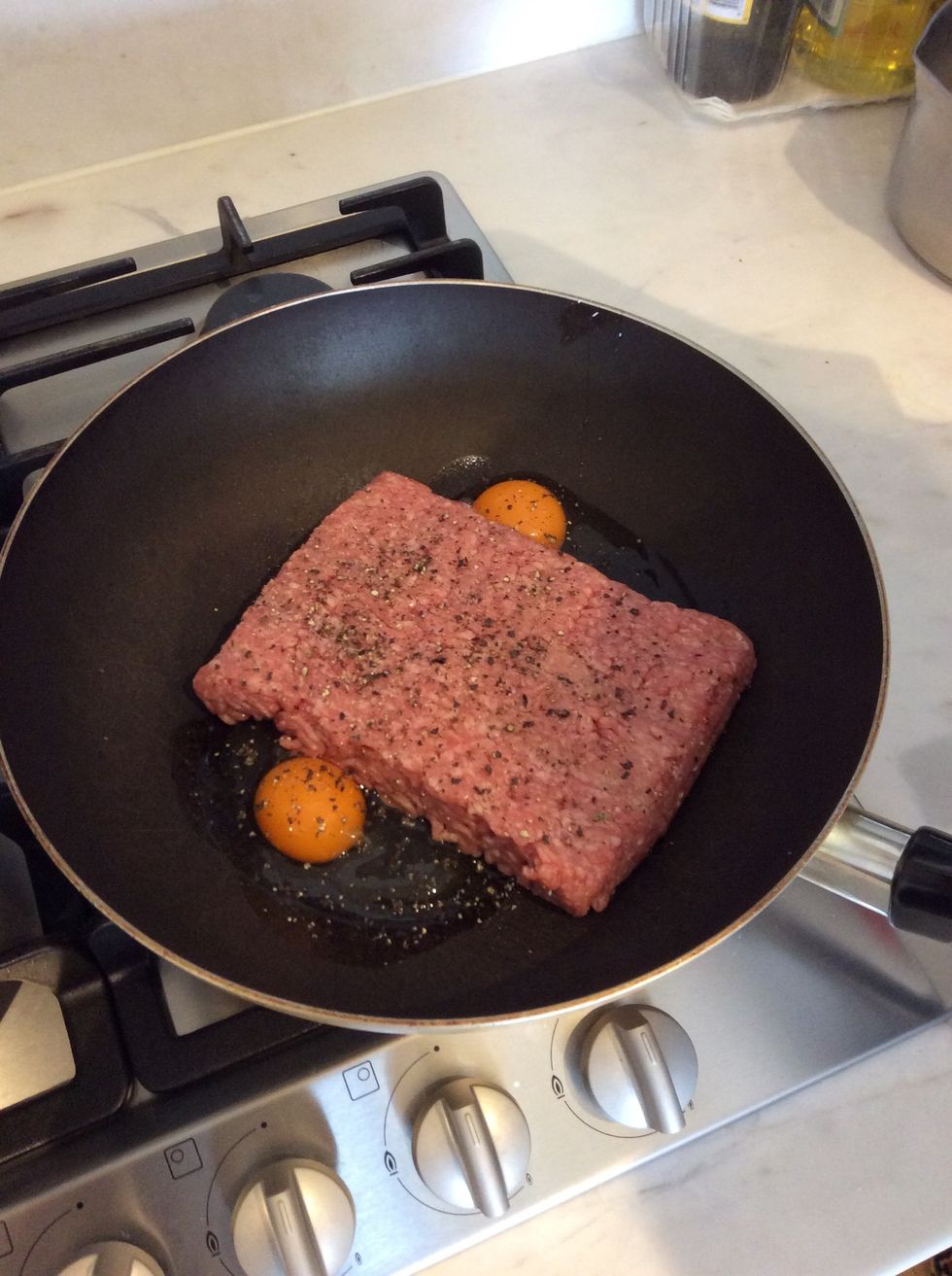 Then you put the ground meat and two eggs and pepper and salt and cooking wine in and mix them