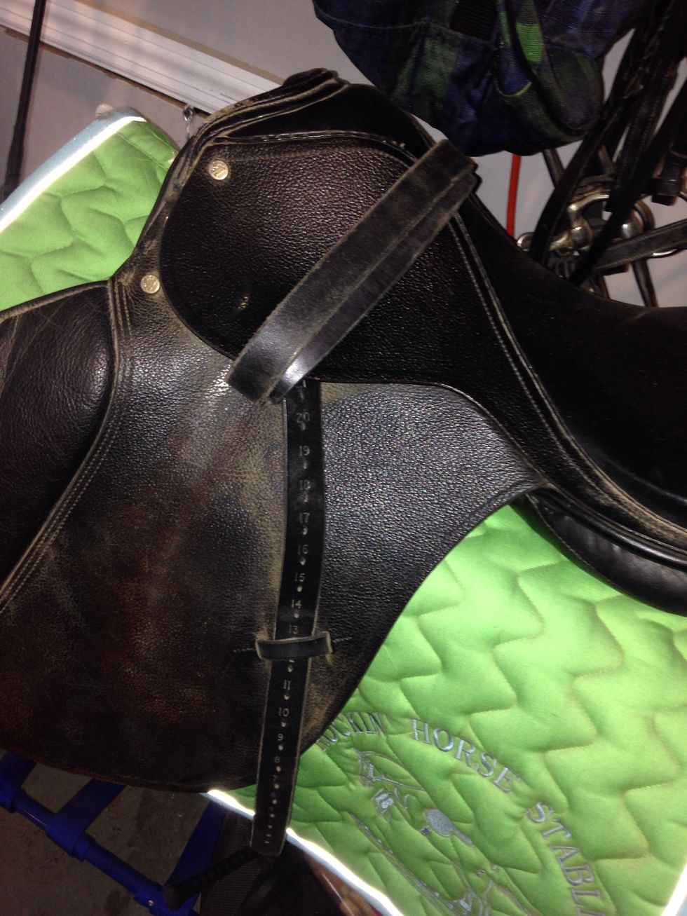 Then you put the saddle on which is the most important step. Then under the saddle you lift up the flaps and you'll see hooks I didn't have my girth but you need that to secure the saddle in place