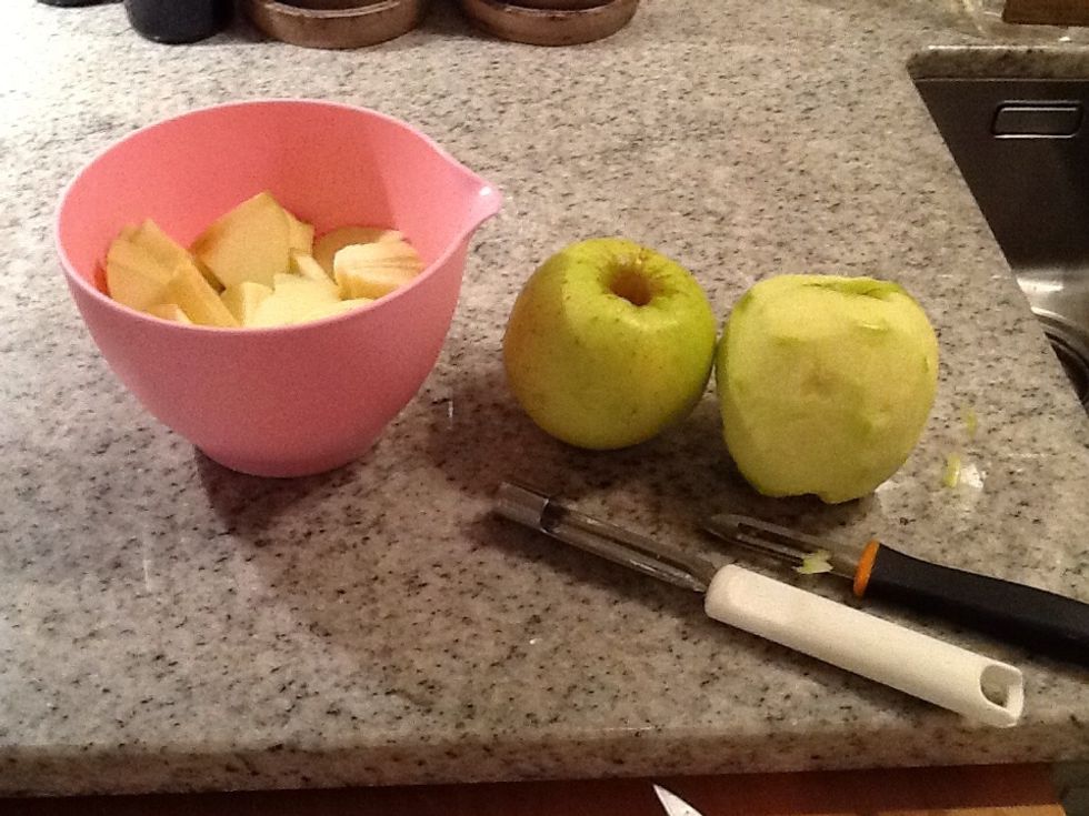 Then you scales the apples and make bites of them. And after that you grease the dish with butter.