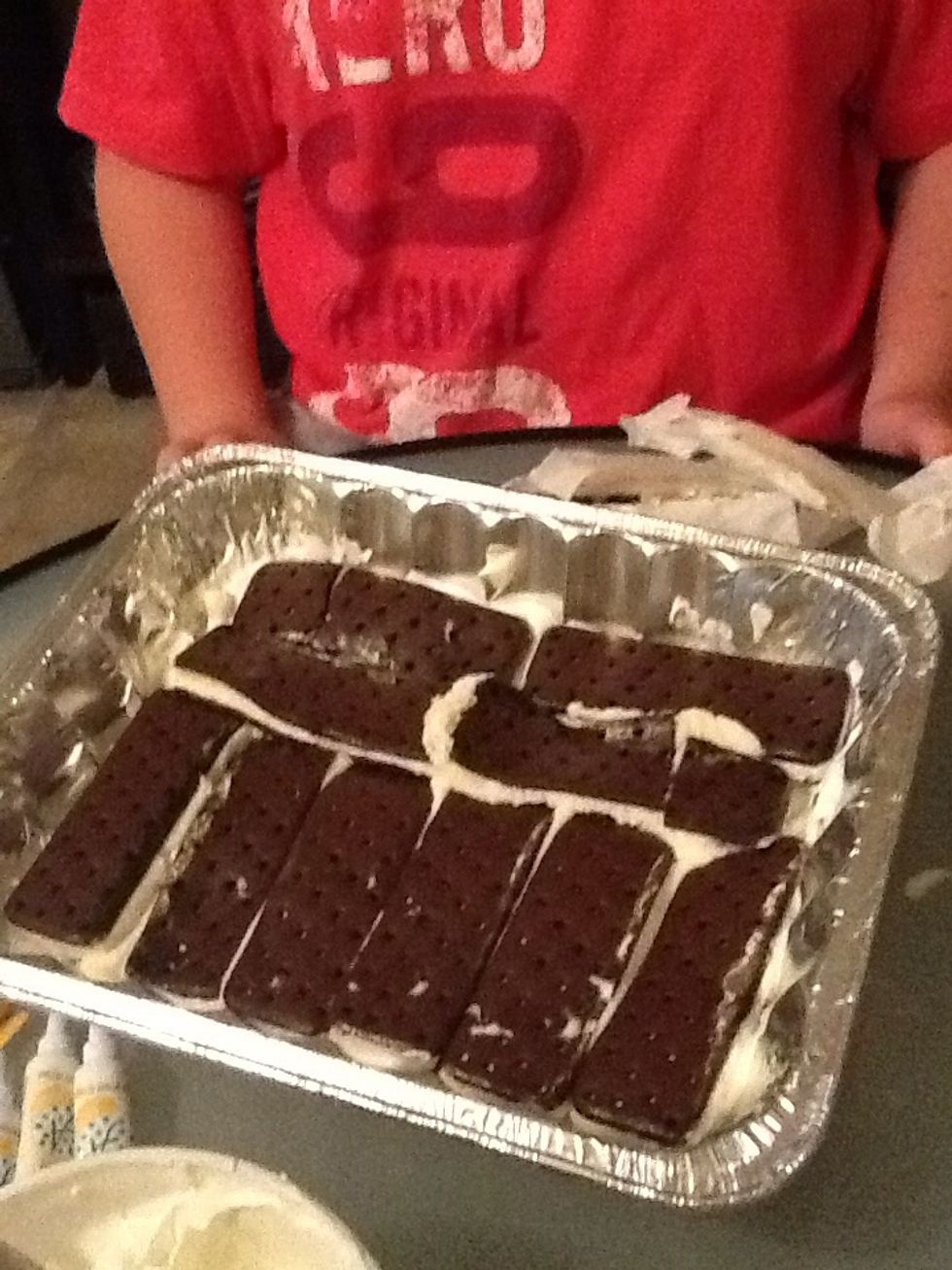 Then you spread out the ice cream sandwiches of your choice