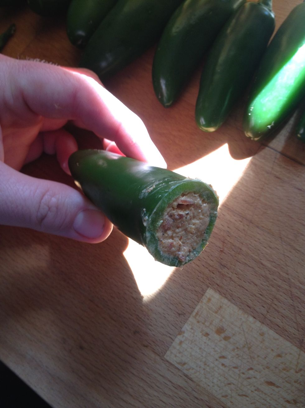 Then you stuff it. Use butter knife so you can poke out air pockets so you can get fully stuffed.